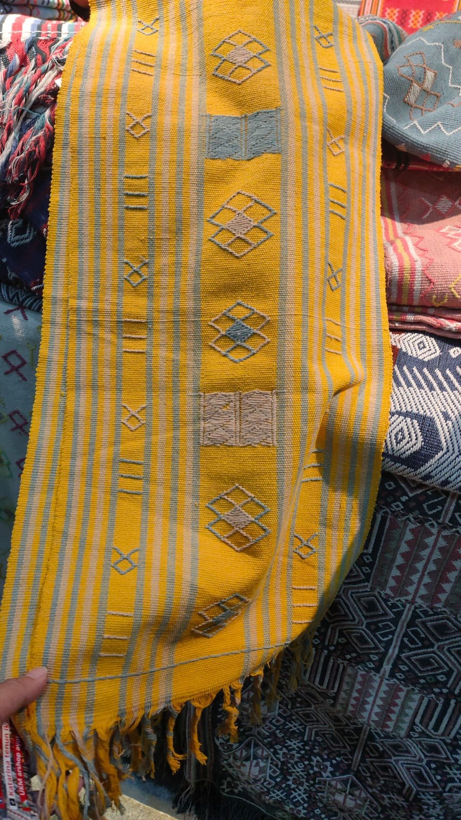 Close view of a handwoven Indonesian heritage textile at KKI